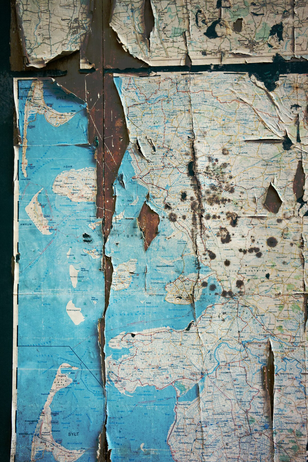 Vintage brass key resting on a weathered map
