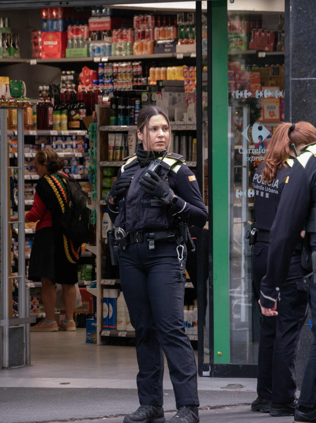 store security guard monitoring shoppers