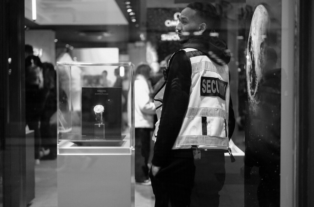 store detective watching security footage