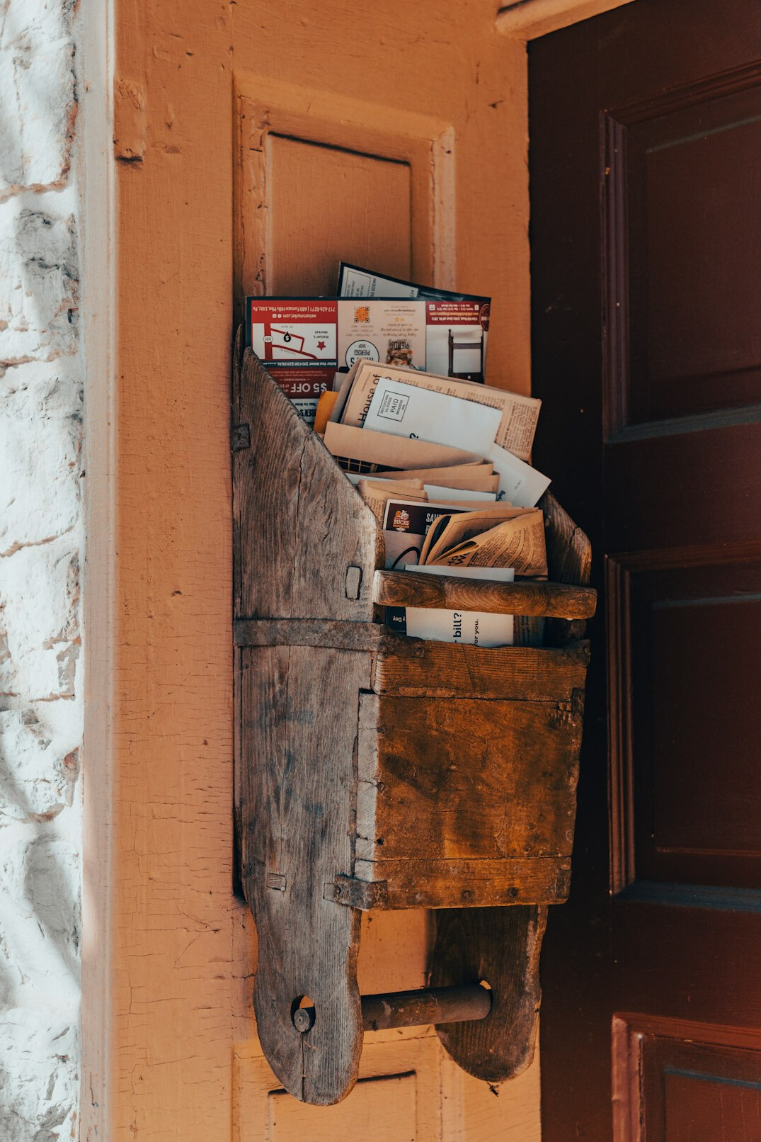 Old sepia photographs and letters inside a wooden box