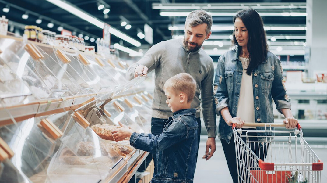 group of shoppers in supermarket