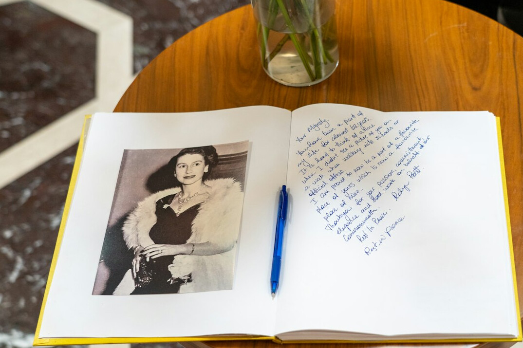 Open notebook with a handwritten story draft and a pen